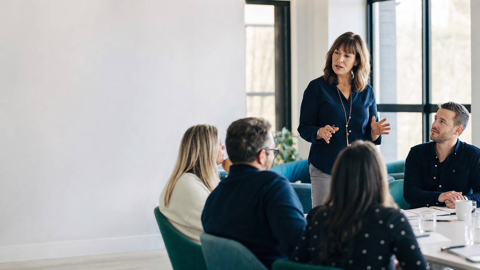 A facilitator leading practical management communication training